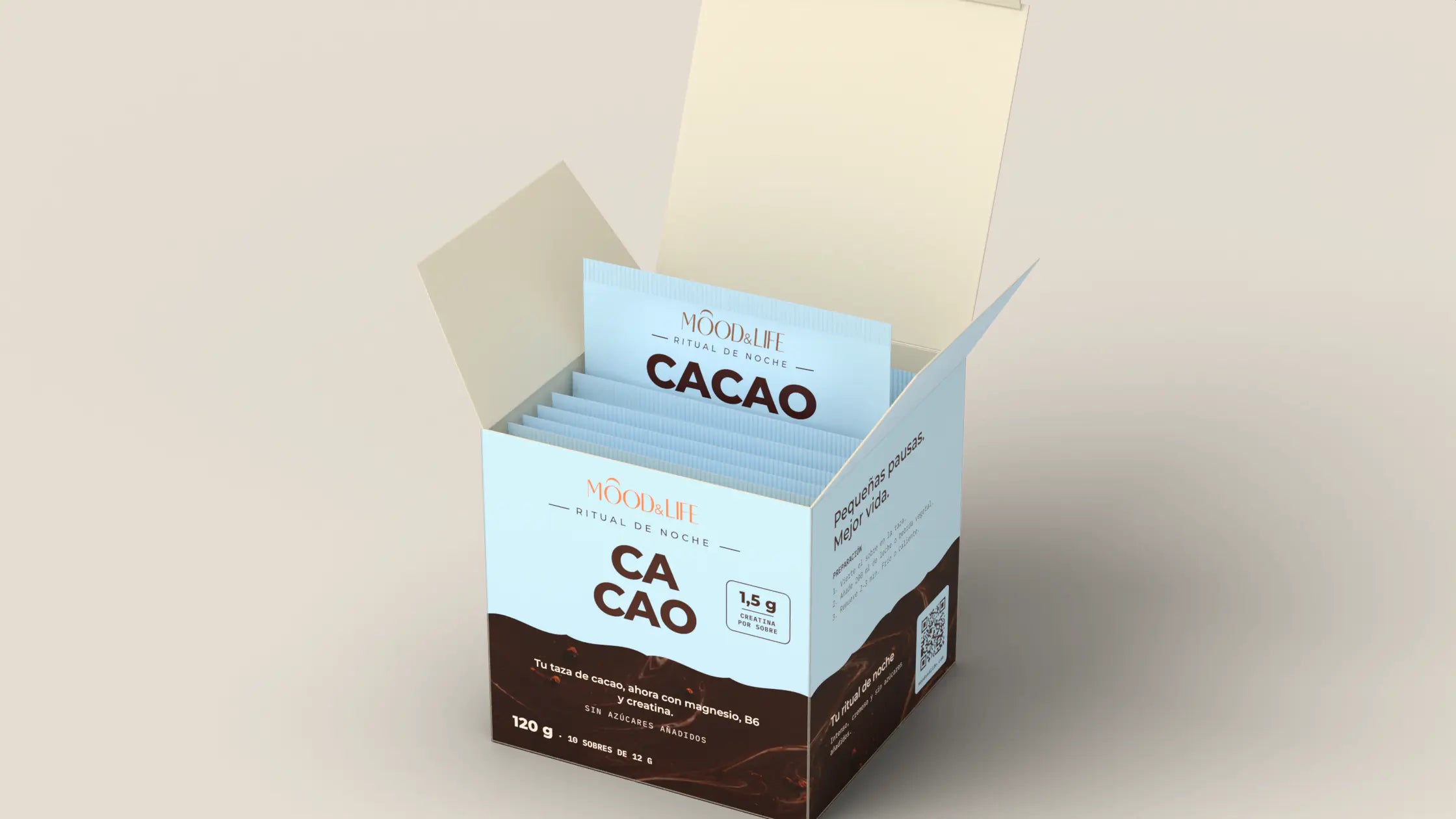 La caja de Cacao Ritual abierta, con un sobre individual saliendo de ella.